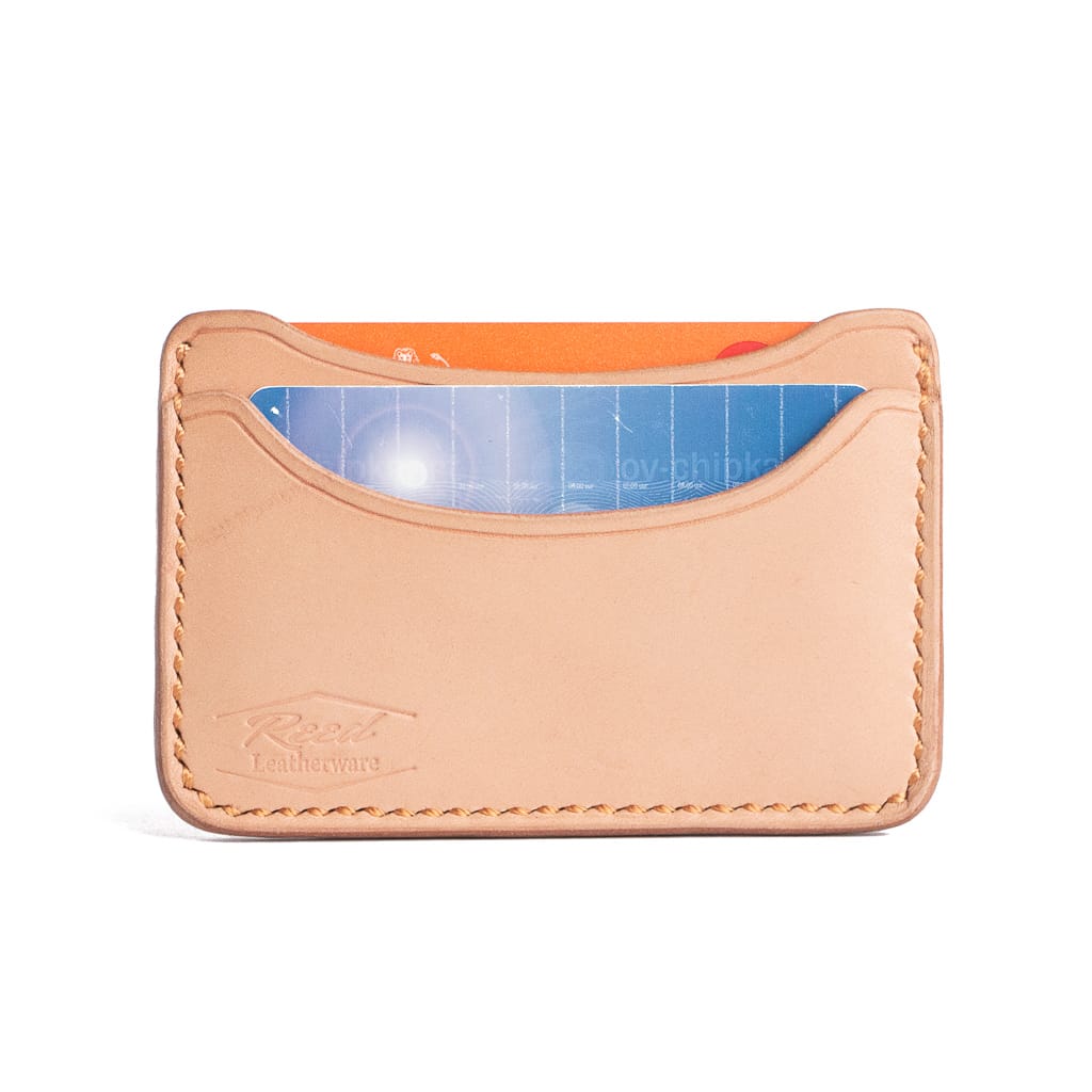 veg tan cardholder on white background with cards inside. Made by Reed Leatherware. 