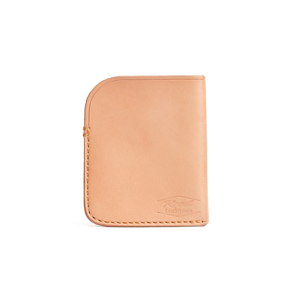 small vegetable tanned minimalist wallet made by Reed Leatherware.  The wallet sits on a white background. 